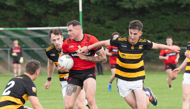 Mitchelstown's Sean Walsh breaks away from Buttevant's Aaron Trimm. Picture: Howard Crowdy