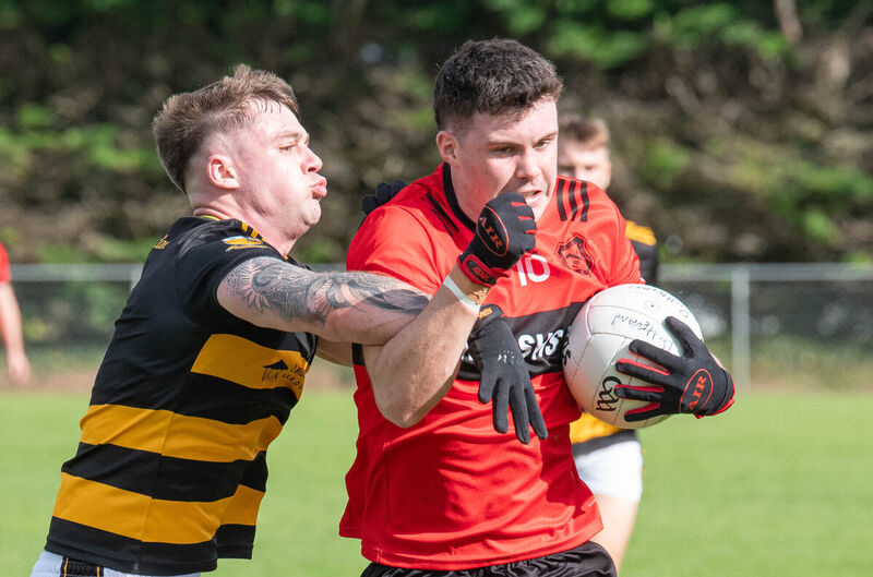 Mitchelstown's Stephen Kenneally evades the challenge from Buttevant's Kyle Bowles. Picture: Howard Crowdy