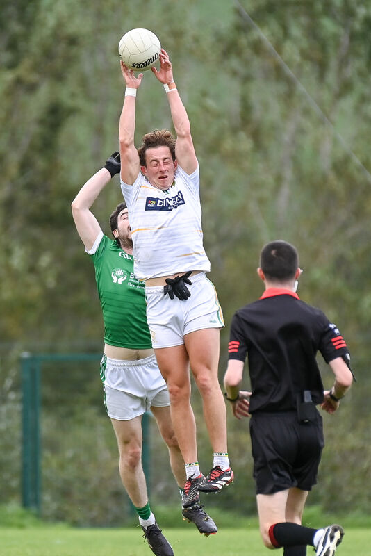 St Michael's Robbie Cotter goes high to win possession ahead of Ballincollig's Sean O'Donoghue. Picture: David Keane. St Michael's Robbie Cotter goes high to win possession ahead of Ballincollig's Sean O'Donoghue. Picture: David Keane.