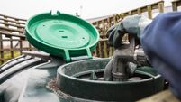 Heating oil delivery, nozzle placed into oil tank to refill