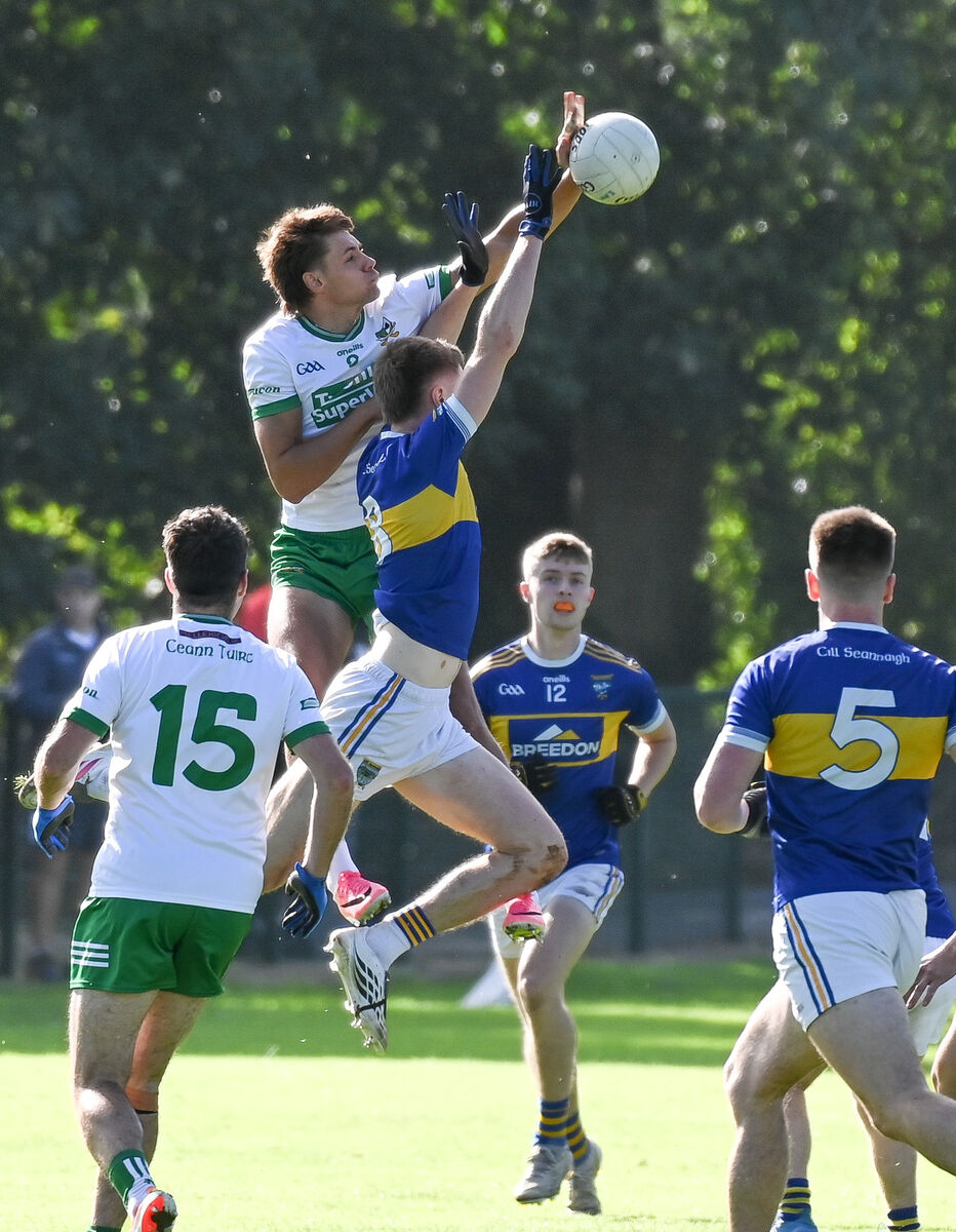  Kanturk's Alan Walsh and Kilshannig's Tom Cunningham compete in the air at Kilbrin. Picture: David Keane.