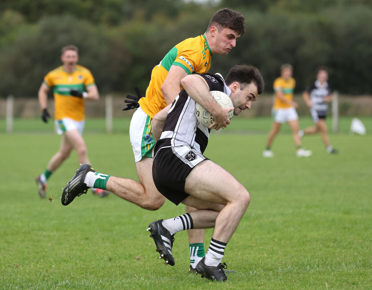 Ronan McSweeney, Glanmire, tackling Gary Murphy, Castletownbere. Picture: Jim Coughlan. Ronan McSweeney, Glanmire, tackling Gary Murphy, Castletownbere. Picture: Jim Coughlan.