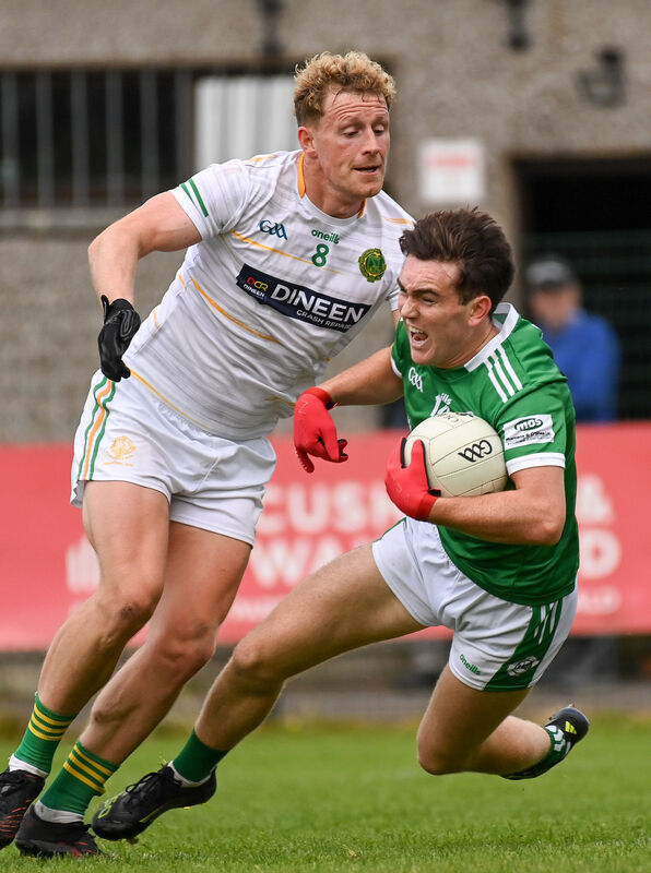 Ballincollig's Danny Miskella is tackled by St Michael's Eoin Hickey during their Premier SFC relegation play-off match at Ovens. Picture: David Keane. Ballincollig's Danny Miskella is tackled by St Michael's Eoin Hickey during their Premier SFC relegation play-off match at Ovens. Picture: David Keane.