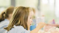School dinners.jpg Young girl eating hot school dinner uk