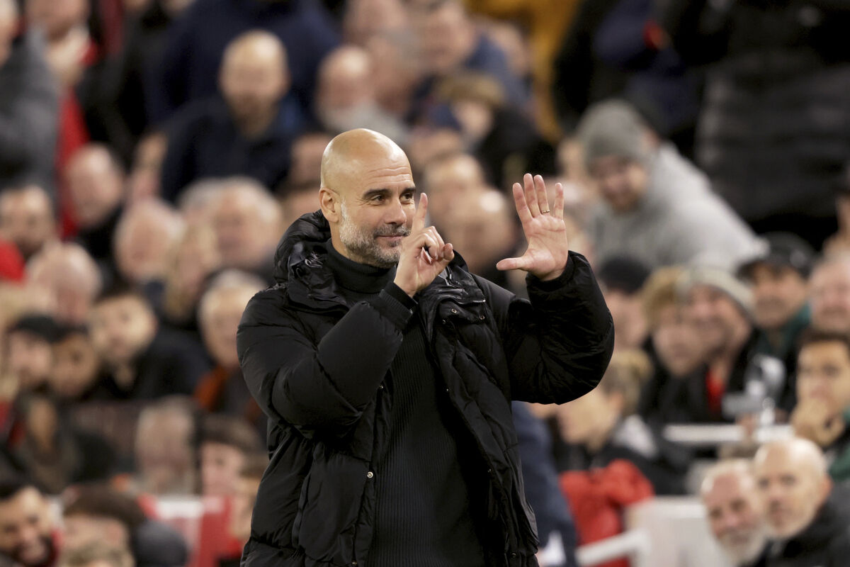 Manchester City's head coach Pep Guardiola puts up six fingers to remind the jeering fans of his six Premier League titles at the end of the English Premier League soccer match against  Liverpool and Manchester City at Anfield Stadium in 2024. Picture: AP Photo/Ian Hodgson