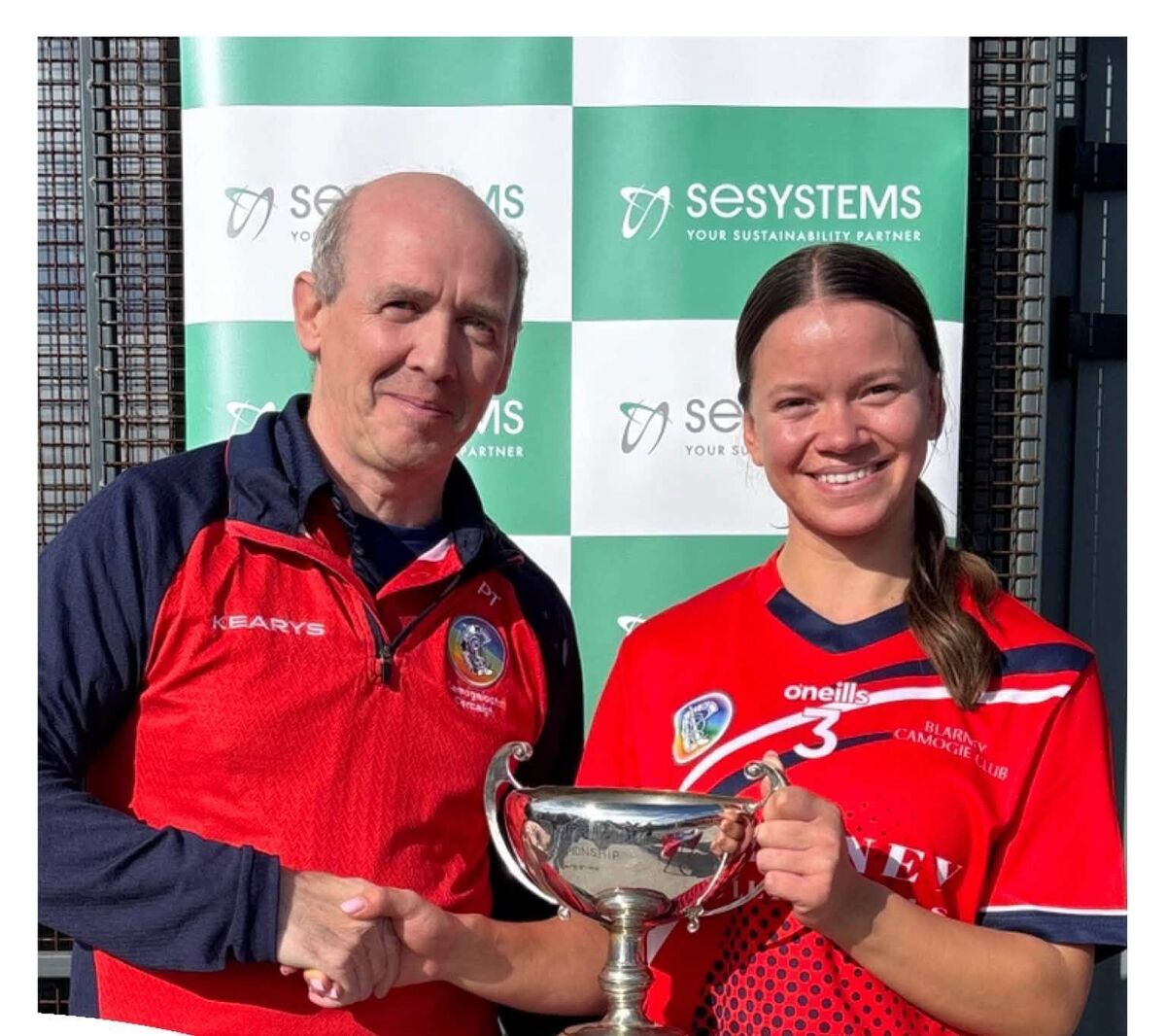 Blarney captain Alana Cotter is presented with the Junior A championship cup by Padraic Treacy, chairman Cork Camogie Board. Blarney captain Alana Cotter is presented with the Junior A championship cup by Padraic Treacy, chairman Cork Camogie Board.