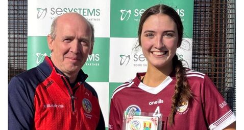Sile Og Walsh Bishopstown is presented with The Echo player of the Match in the Premier Junior Championship final by Padraic Tr Cork camogie titles for Bishopstown, Blarney and Kilworth