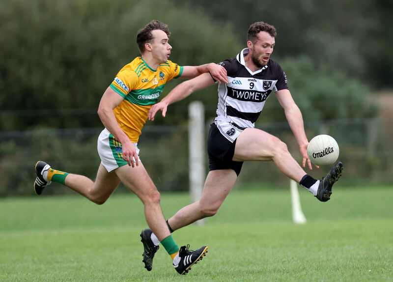 Harry Jones, Glanmire, puts Fintan Fenner, Castletownbere under pressure during their PIFC relegation playoff. Picture: Jim Coughlan.