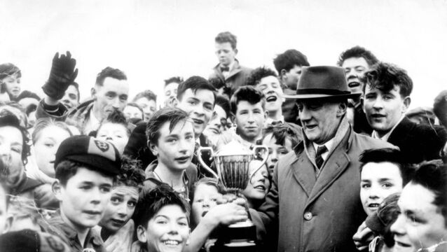 <p>Gerald McCarthy receiving his first ever trophy from Denis 'Chalkie' Crowley after Bandon Road's victory in the Lough Parish League in 1957. </p> <p>Gerald McCarthy receiving his first ever trophy from Denis 'Chalkie' Crowley after Bandon Road's victory in the Lough Parish League in 1957. </p>