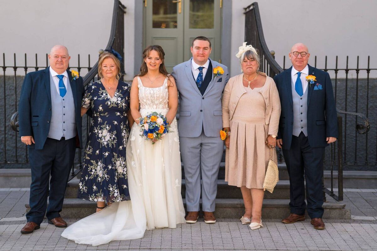 Alison and John said they felt lucky to able to make the occasion with their families. They are pictured here with their parents.