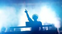 Club, disco DJ playing and mixing music for people. Nightlife