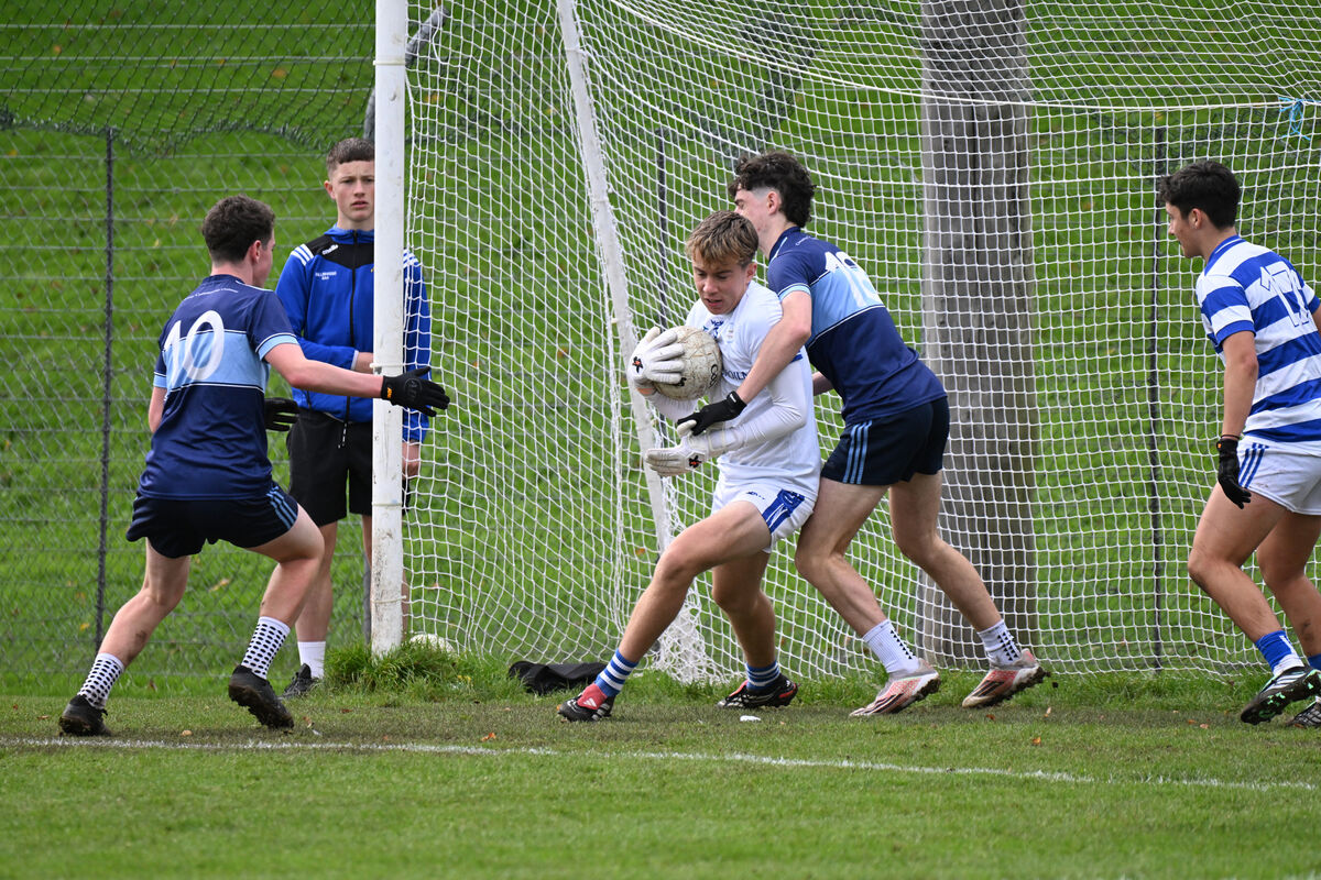 Riain O'Sullivan, Coláiste Choilm goalkeeper, battles to clear from the goal under pressure from Clonakilky CC. Picture: Larry Cummins Riain O'Sullivan, Coláiste Choilm goalkeeper, battles to clear from the goal under pressure from Clonakilky CC. Picture: Larry Cummins