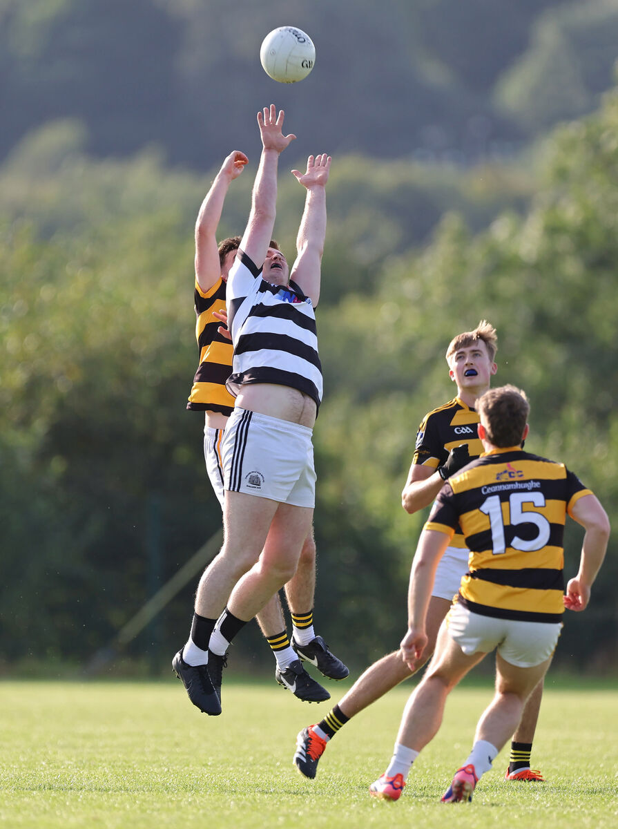  Ken McCarthy Coade, St Nicks, battles for the high ball with Shane Riordan, Canovee. Picture: Jim Coughlan.