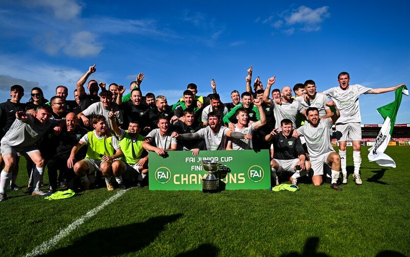 Coachford players and staff celebrate with the trophy after the FAI Junior Cup final between Coachford and Evergreen at Munster FA Turner's Cross Park in Cork. Photo by Tyler Miller/Sportsfile Coachford players and staff celebrate with the trophy after the FAI Junior Cup final between Coachford and Evergreen at Munster FA Turner's Cross Park in Cork. Photo by Tyler Miller/Sportsfile