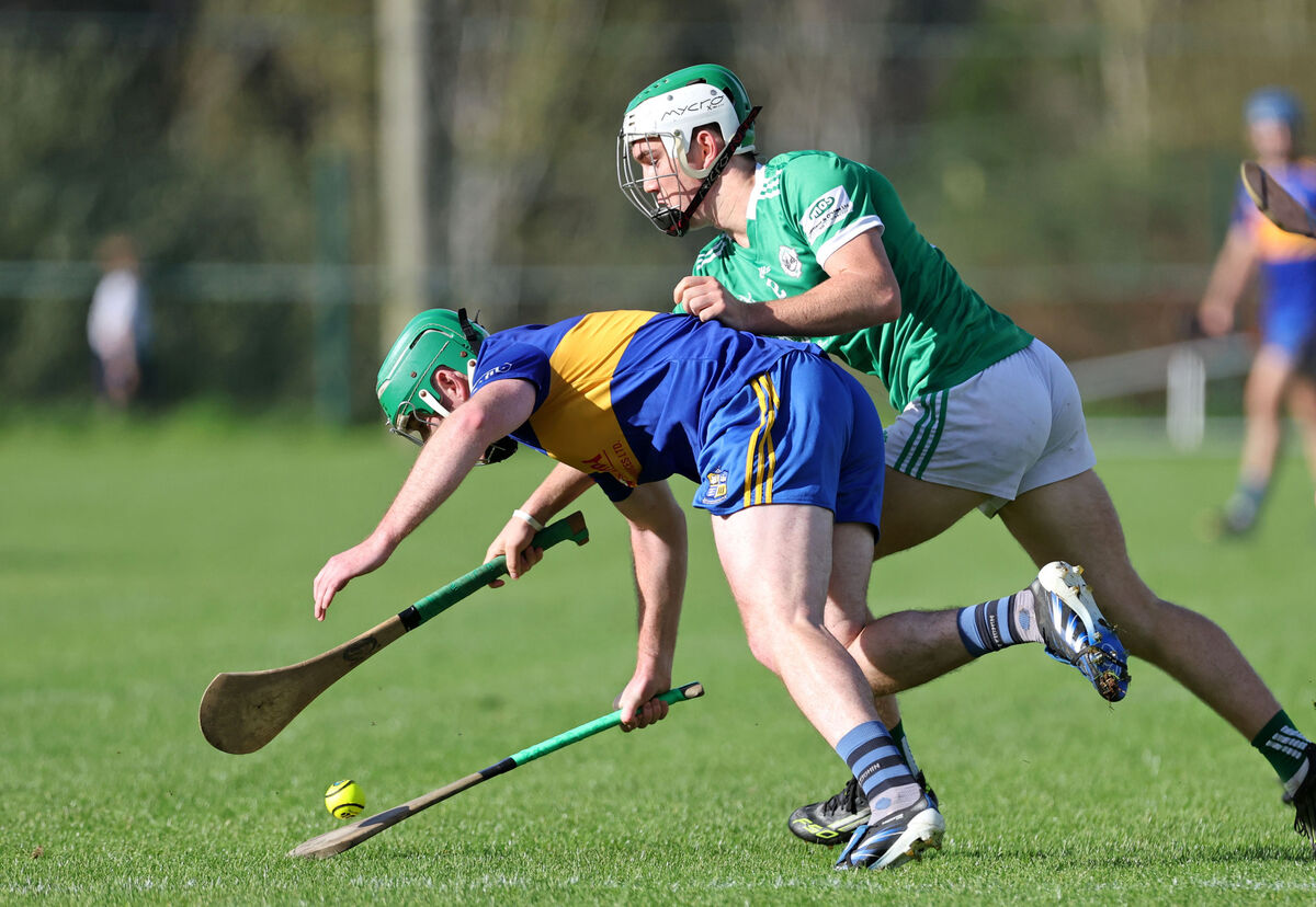  David Stack, Carrigaline, is tackled by Danny Miskella, Ballincollig. Picture: Jim Coughlan.