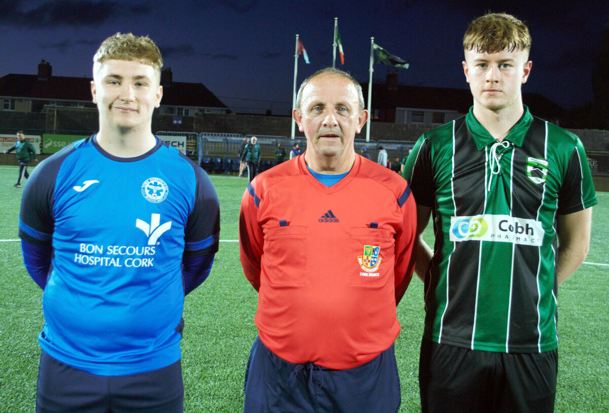 Springfield's captain Jonah Walsh (right), with Cork Hospital's Jamie O'Neill, accompanied by referee Paul Bowdren. Springfield's captain Jonah Walsh (right), with Cork Hospital's Jamie O'Neill, accompanied by referee Paul Bowdren.