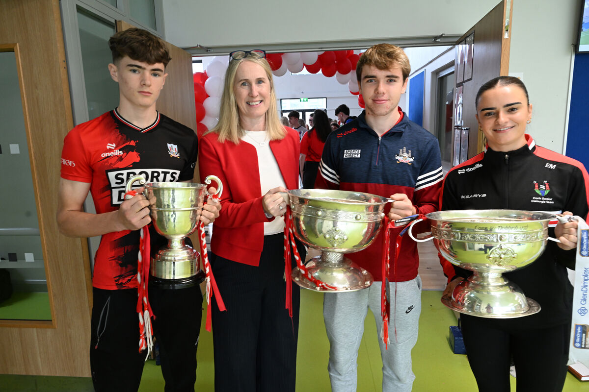 Principal Lorna Dundon and pupils Josh Hegarty and Darragh O'Sullivan and teacher Emma Murphy proudly displaying the silverware at Carrigtwohill Community College. Principal Lorna Dundon and pupils Josh Hegarty and Darragh O'Sullivan and teacher Emma Murphy proudly displaying the silverware at Carrigtwohill Community College.