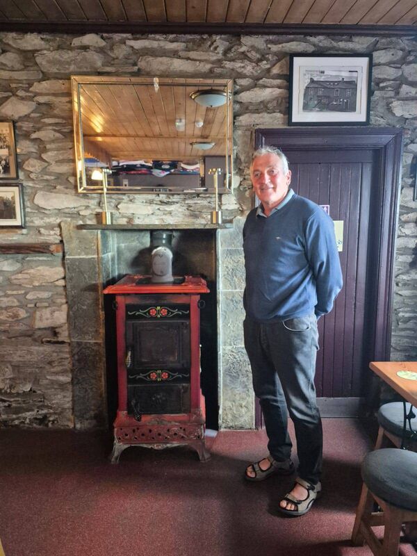 Thomas Ó Murchú beside the burner in his bar in Kilnamartyra, which is much admired by the regulars Thomas Ó Murchú beside the burner in his bar in Kilnamartyra, which is much admired by the regulars