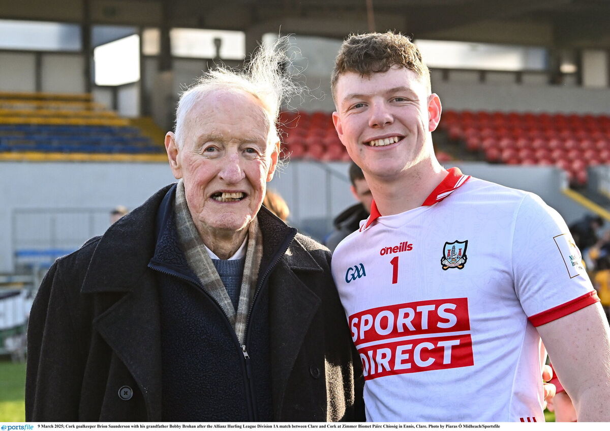Cork goalkeeper Brion Saunderson with his grandfather Bobby Brohan after the Allianz Hurling League Division 1A match between Clare and Cork at Zimmer Biomet Páirc Chíosóg in Ennis, Clare. Photo by Piaras Ó Mídheach/Sportsfile