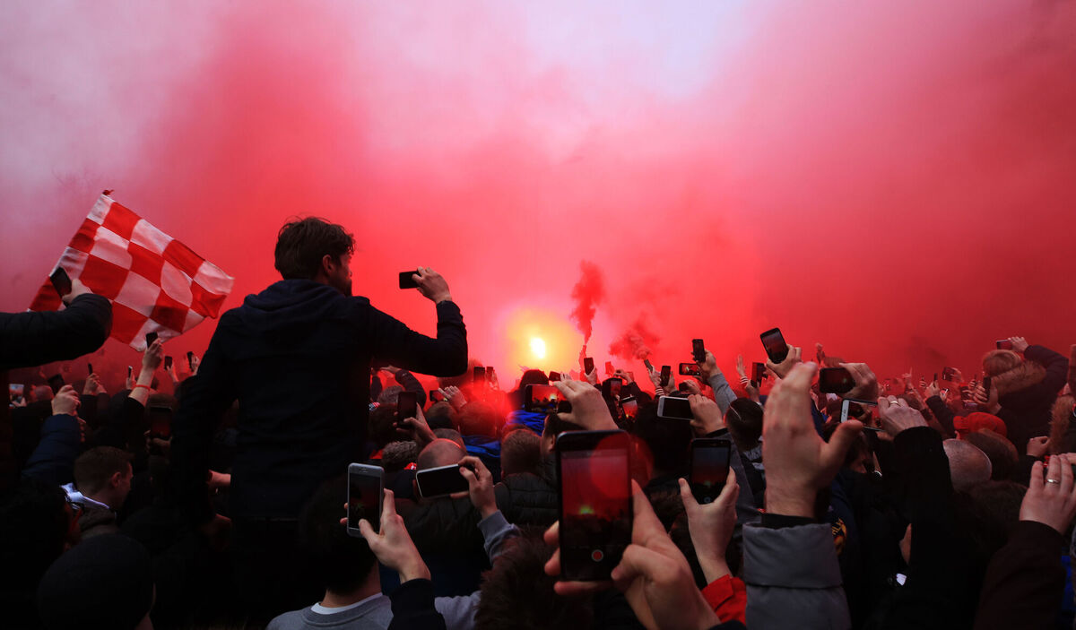 Liverpool fans let off flares as the Manchester City team bus arrived at Anfield for the UEFA Champions League quarter final, first leg match back in 2018. Picture: Peter Byrne/PA Wire Liverpool fans let off flares as the Manchester City team bus arrived at Anfield for the UEFA Champions League quarter final, first leg match back in 2018. Picture: Peter Byrne/PA Wire