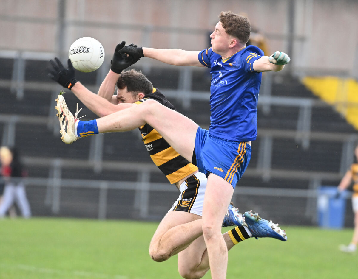 Ballymacelligott's Darragh Broderick goes high with Buttevant's Kevin Lenahan. Picture: Eddie O'Hare