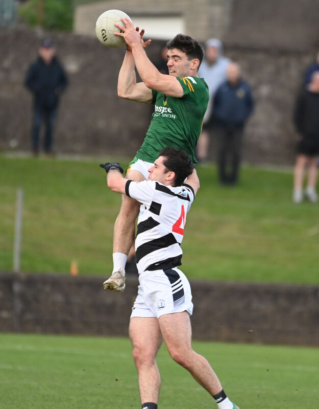 2026 Cobh's Adam Lynch goes high from St. Nicks' Ciaran Horgan. Picture: Eddie O'Hare