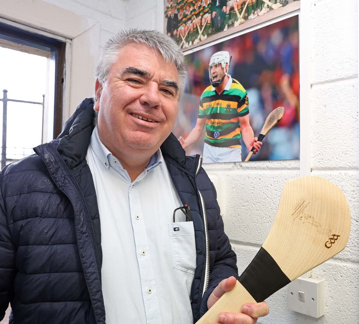 Liam Martin, Glen Rover Chairperson with the hurley presented to Patrick Horgan for the Leading scorer in Gaa league and championship hurling 2025 and Patrick Horgan in the backround. Liam Martin, Glen Rover Chairperson with the hurley presented to Patrick Horgan for the Leading scorer in Gaa league and championship hurling 2025 and Patrick Horgan in the backround.