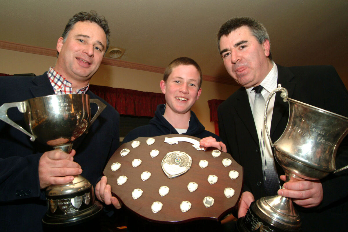 U13 captain Ian O'Regan gets help from Tomas Mulcahy and outgoing underage committee chairman Liam Martin with the City Hurling League and Hurling Championship Cups and The Radley Sheild at the club presentation at Glen Rovers U13 captain Ian O'Regan gets help from Tomas Mulcahy and outgoing underage committee chairman Liam Martin with the City Hurling League and Hurling Championship Cups and The Radley Sheild at the club presentation at Glen Rovers