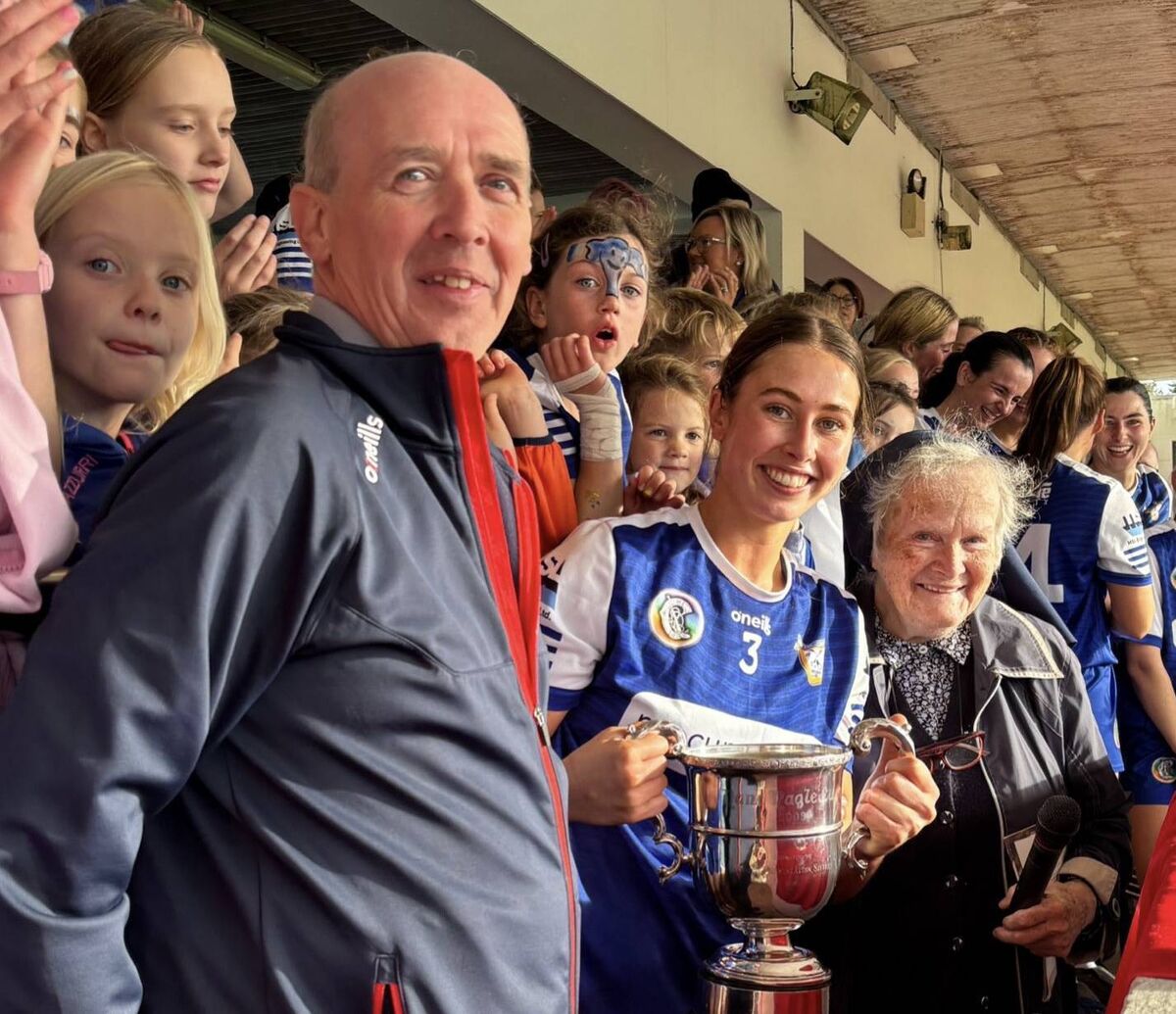 Ballinhassig captain Triona Healy is presented with the SE Systems Premier Intermediate cup by Padraig Treacy, chairperson Cork Camogie Association. Ballinhassig captain Triona Healy is presented with the SE Systems Premier Intermediate cup by Padraig Treacy, chairperson Cork Camogie Association.