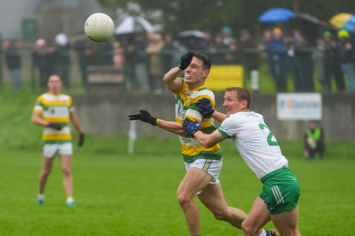 Carbery Rangers’ John O’Rourke fists the ball away as John McLoughlin comes in with a tackle. Picture: Noel Sweeney Carbery Rangers’ John O’Rourke fists the ball away as John McLoughlin comes in with a tackle. Picture: Noel Sweeney