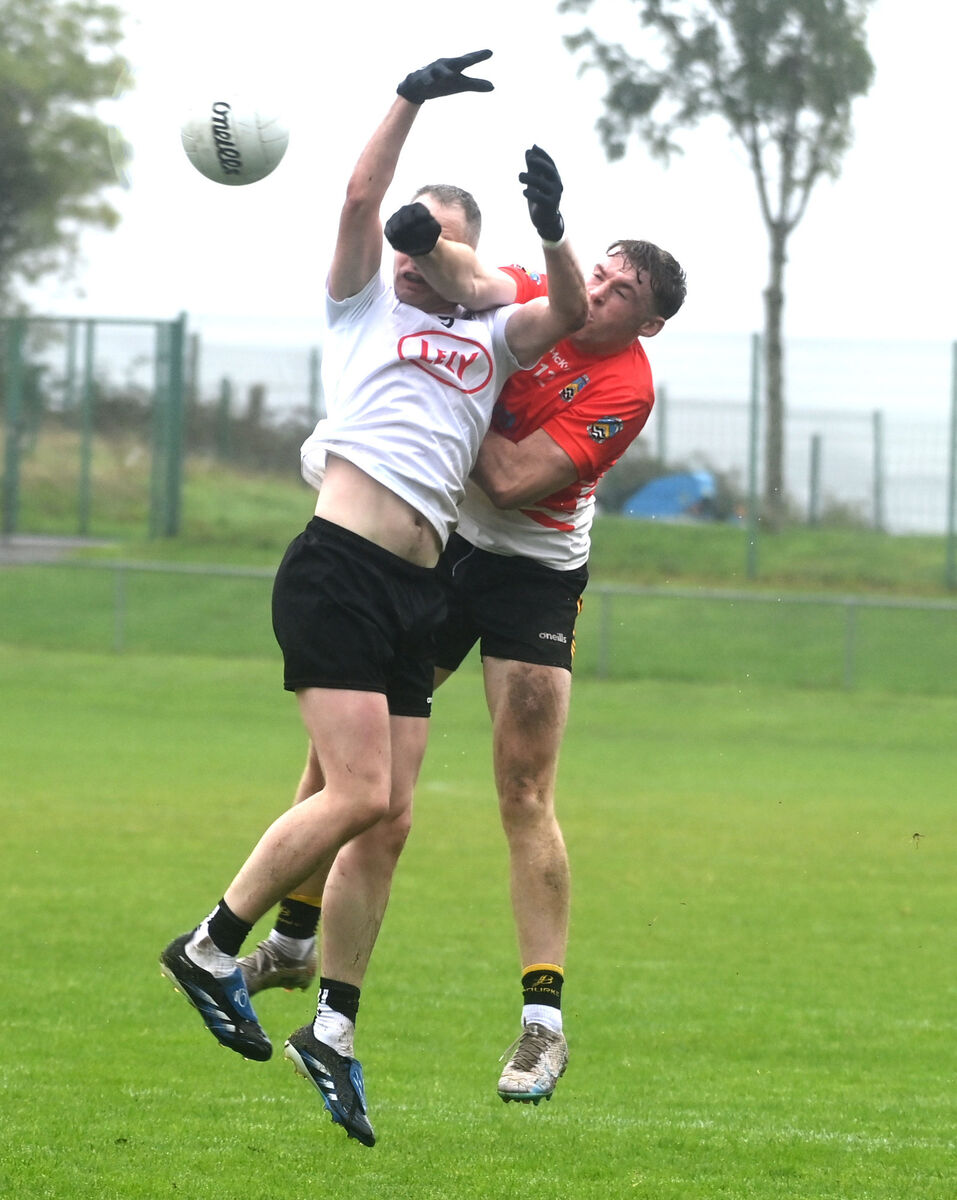 Fermoy's Eoin Healy punches the ball away from Kiskeam's Gene Casey. Picture: Eddie O'Hare Fermoy's Eoin Healy punches the ball away from Kiskeam's Gene Casey. Picture: Eddie O'Hare