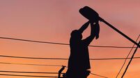 Silhouette of Electrician checking lighting to the LED street lamp post, Technician with clipping path and maintenance service c