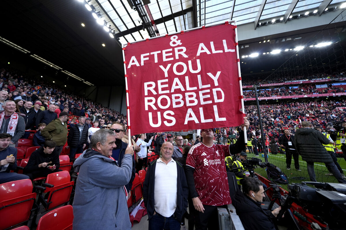 Liverpool fans hold up a large banner with the words '& After All You Really Robbed Us All' before the Premier League match at Anfield, Liverpool. Liverpool fans hold up a large banner with the words '& After All You Really Robbed Us All' before the Premier League match at Anfield, Liverpool.