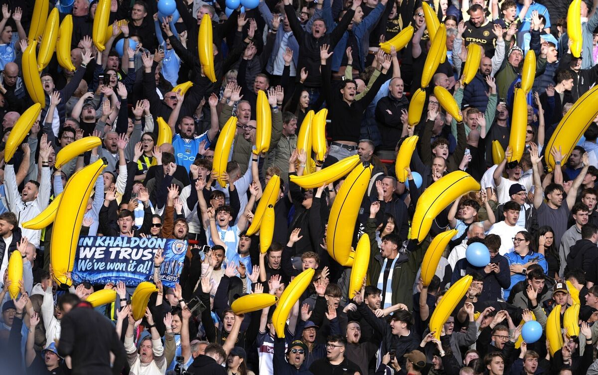 Manchester City fans hold up inflatable bananas before the Premier League match at Anfield, Liverpool. Picture: Peter Byrne/PA Wire Manchester City fans hold up inflatable bananas before the Premier League match at Anfield, Liverpool. Picture: Peter Byrne/PA Wire