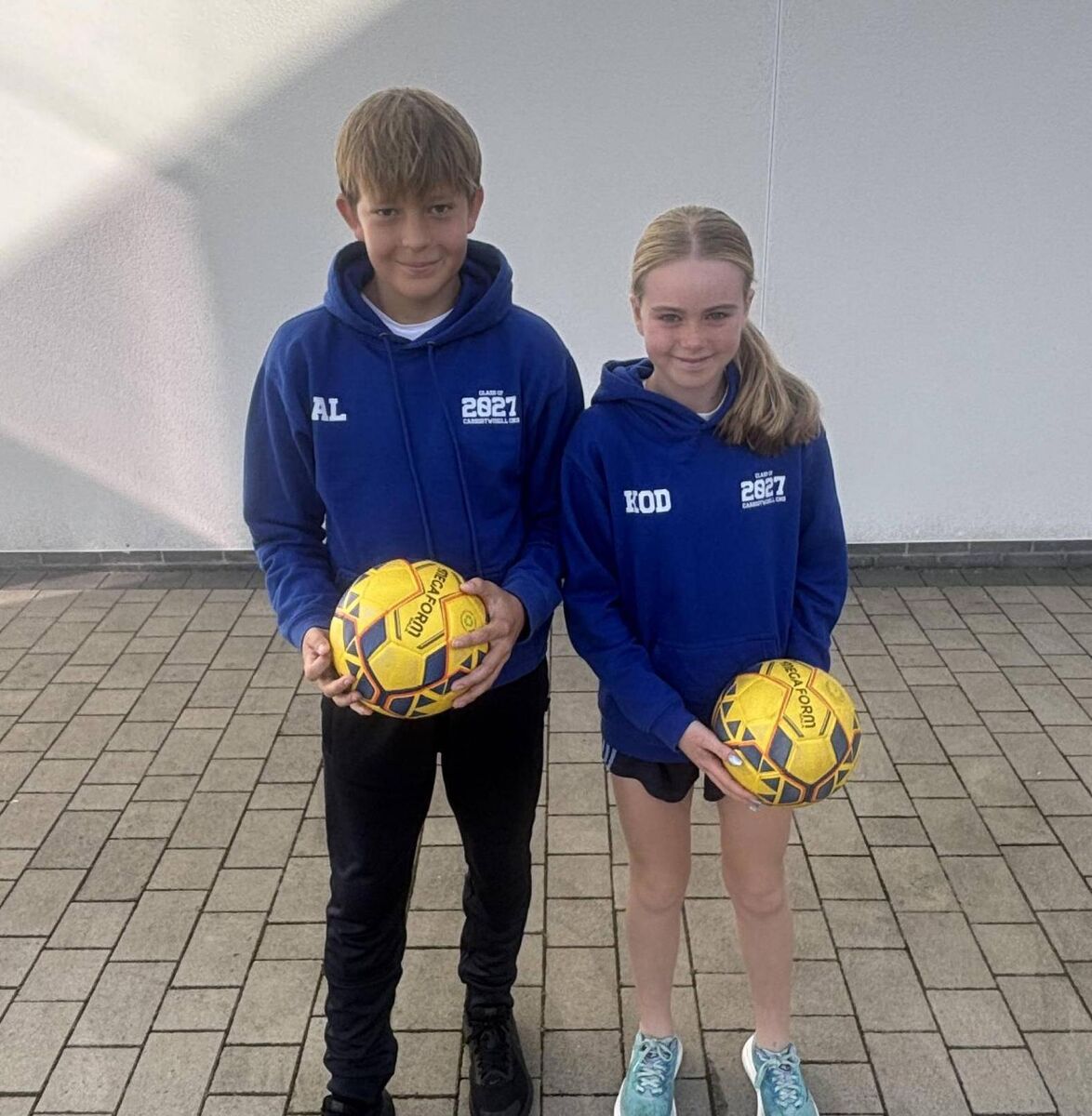 The Carrigtwohill CNS team captains Ajus Lepeska and Kaitlin O’Dea ahead of the Cork Primary Cup. 
