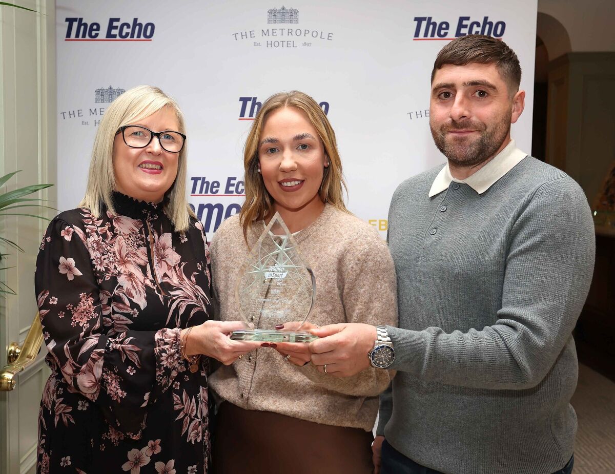 Janice Casey, sales manager The Metropole Hotel, presents the trophy to Emma McCarthy, alongside her husband, Chris Fahy. Picture: Jim COughlan Janice Casey, sales manager The Metropole Hotel, presents the trophy to Emma McCarthy, alongside her husband, Chris Fahy. Picture: Jim COughlan