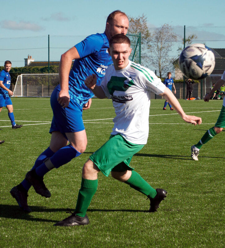 AUL Photos Grattan's Christy Bullman flicks the ball past Waterloo's Dylan Murphy in the action at Rockmount Park. AUL Photos Grattan's Christy Bullman flicks the ball past Waterloo's Dylan Murphy in the action at Rockmount Park.