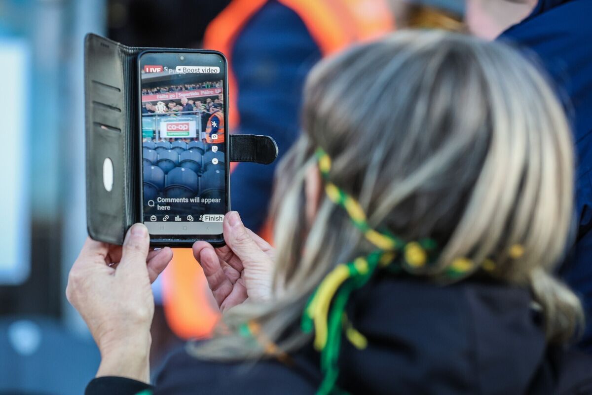 A view of a supporter live streaming Glen Rovers lifting the Seán Óg Murphy Cup