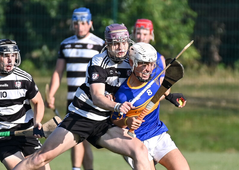  Carrigtwohill's Tom Walsh is tackled by Midleton's Alfie Hennessy. Picture: David Keane.
