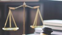 Scales of justice and Gavel on wooden table and Lawyer or Judge working with agreement in Courtroom, Justice and Law concept