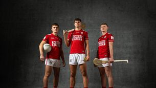 <p>Cork footballer Tommy Walsh (left) and hurlers Brian Hayes and Shane Barrett model the new Cork jersey, which will be worn from 2027. </p>