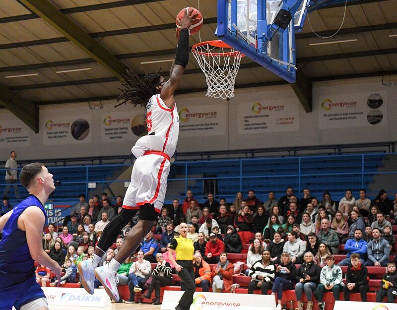 Ballincollig's Andre Nation slams the ball home against Neptune, during their Men's Super League clash at Neptune Stadium. Ballincollig's Andre Nation slams the ball home against Neptune, during their Men's Super League clash at Neptune Stadium.