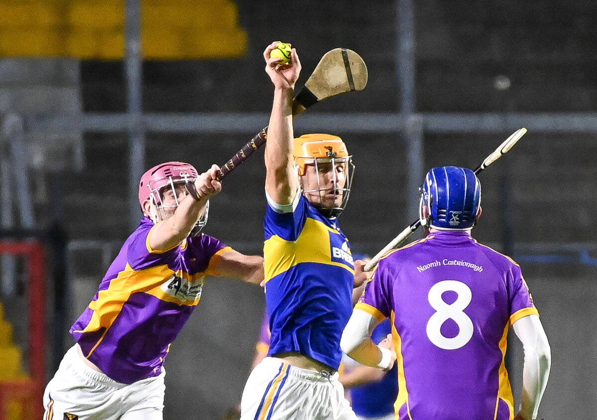 Kilshanning's Jack Twomey makes a fine catch under pressure from St Catherine's Philip Keane. Kilshanning's Jack Twomey makes a fine catch under pressure from St Catherine's Philip Keane.