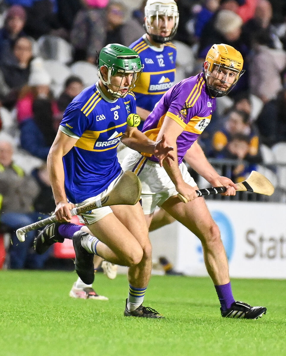 Kilshanning's Andy Hourigan wins possession ahead of St Catherine's Eoin Condon. Kilshanning's Andy Hourigan wins possession ahead of St Catherine's Eoin Condon.