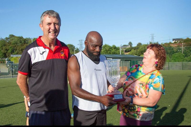 Chairman of Bandon AFC Jim McCarthy, the winning captain Edwin Andepu and Cathal’s mum Christina Murphy.