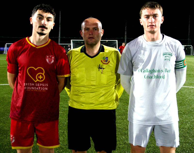 Ballyphehane Celtic's Aaron West (left), with Coachford's Luke Casey, accompanied by referee Paul Higgins. Ballyphehane Celtic's Aaron West (left), with Coachford's Luke Casey, accompanied by referee Paul Higgins.