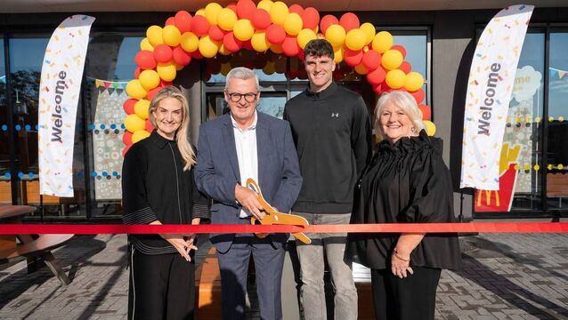 <p>Carrigaline McDonald's franchise owner Jim Ronayne is joined by local GAA star Brian Hayes and crew members to cut the ribbon on the new restaurant. </p>