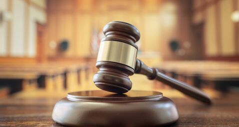 Judges gavel in courtroom legal trial and law background