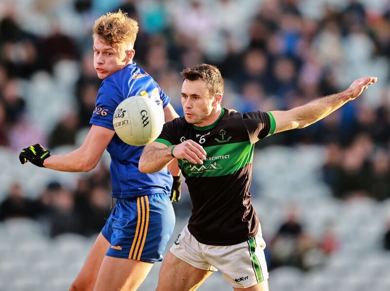Nemo's Stephen Cronin and the Barrs' Thomas Egan keep their eyes on the prize. Picture: Thomas Flinkow/Sportsfile