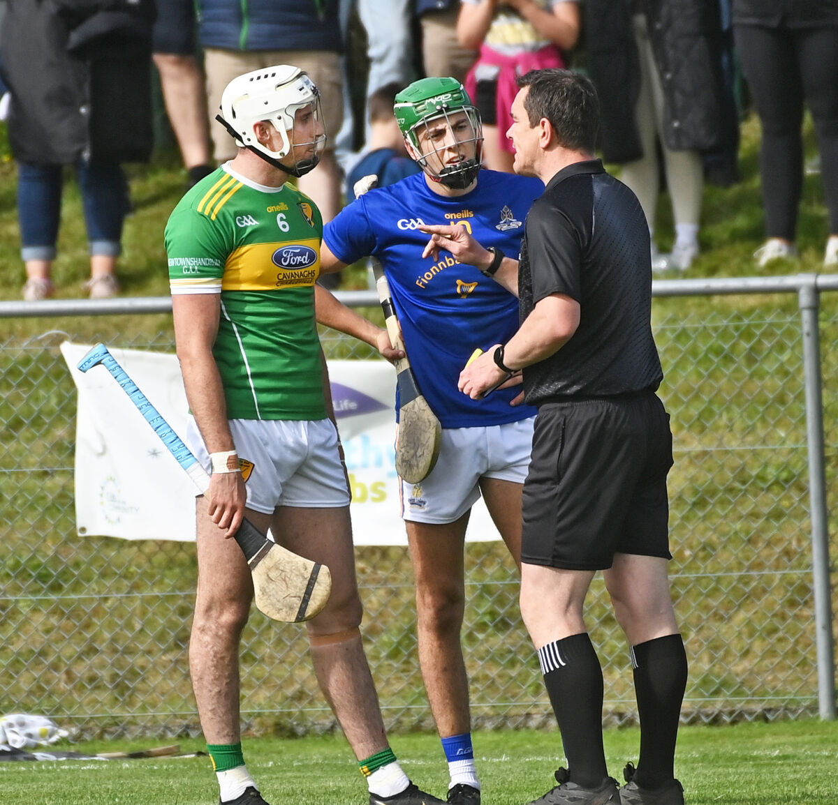 Referee Simon Stokes has words for St Finbarr's Ben Cunningham and Newtownshandrum's Tim O'Mahony. Picture: Eddie O'Hare Referee Simon Stokes has words for St Finbarr's Ben Cunningham and Newtownshandrum's Tim O'Mahony. Picture: Eddie O'Hare